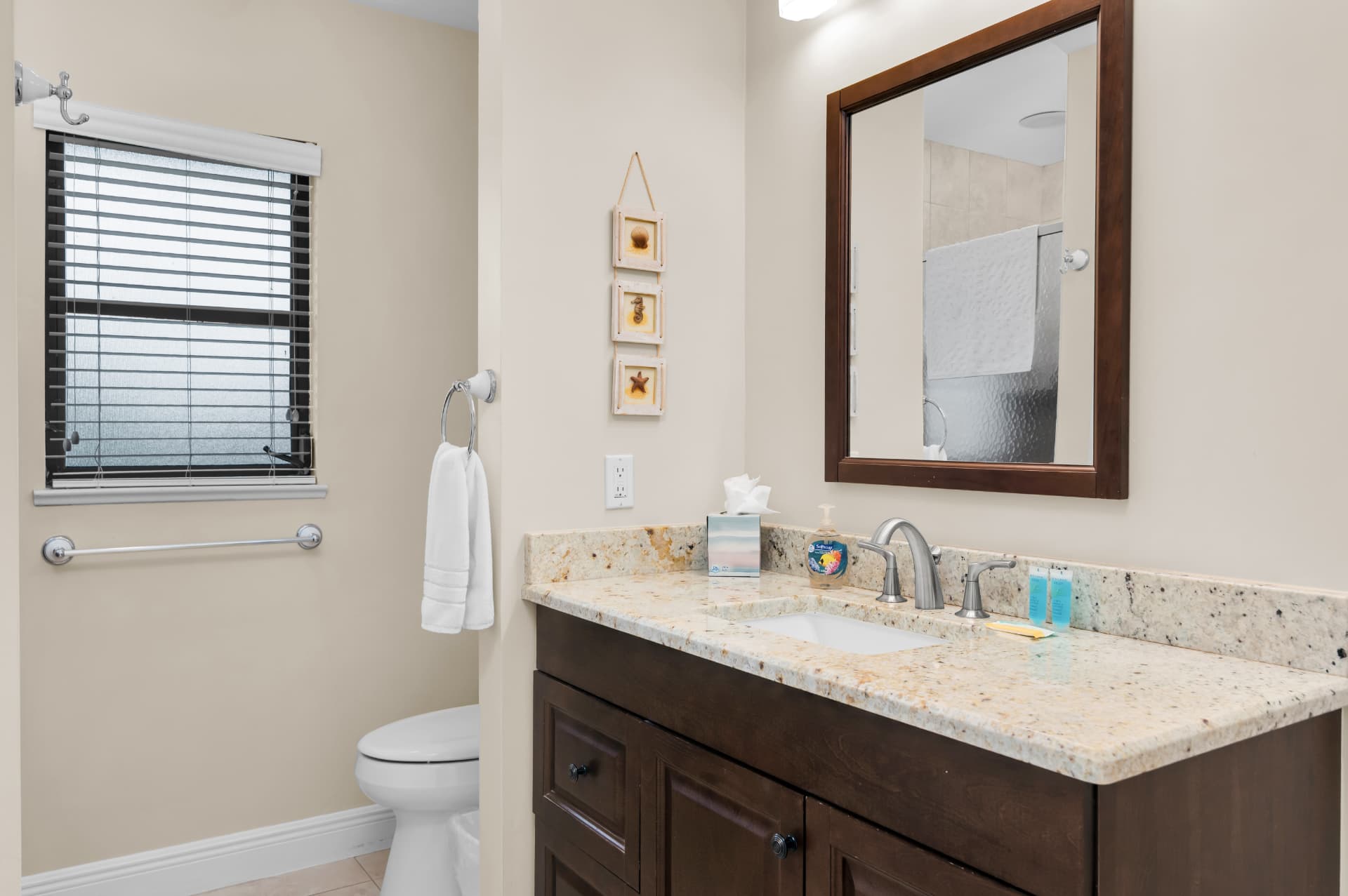 Second bathroom with vanity and mirror at Pirates Cove Marco Island