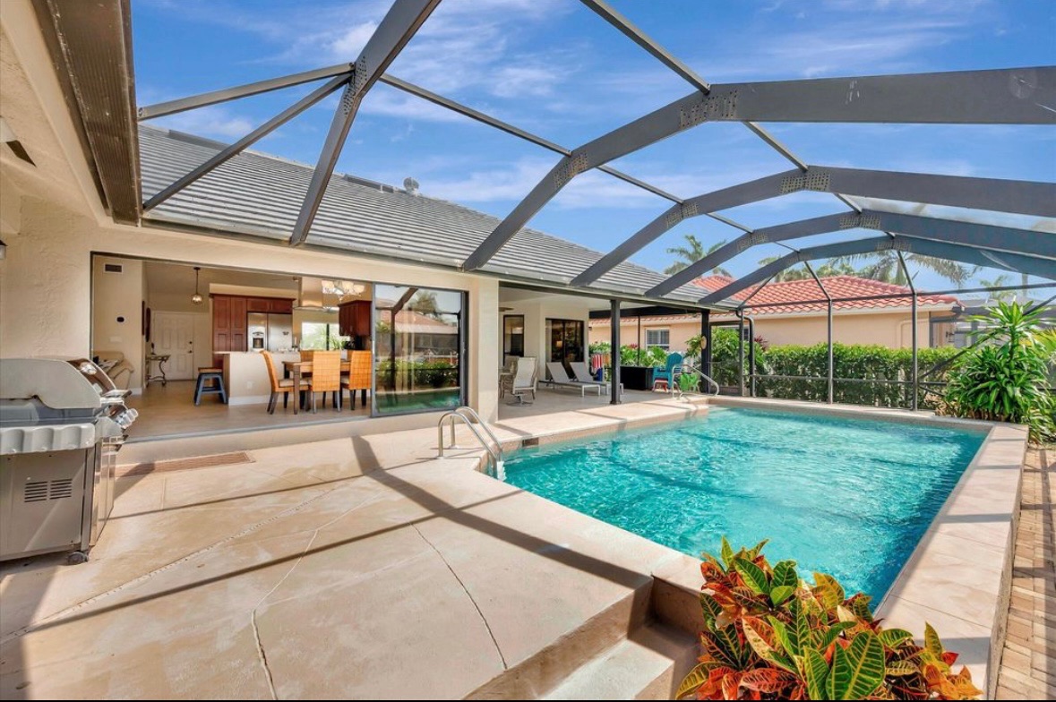 Covered lanai beside the pool at Pirates Cove Marco Island