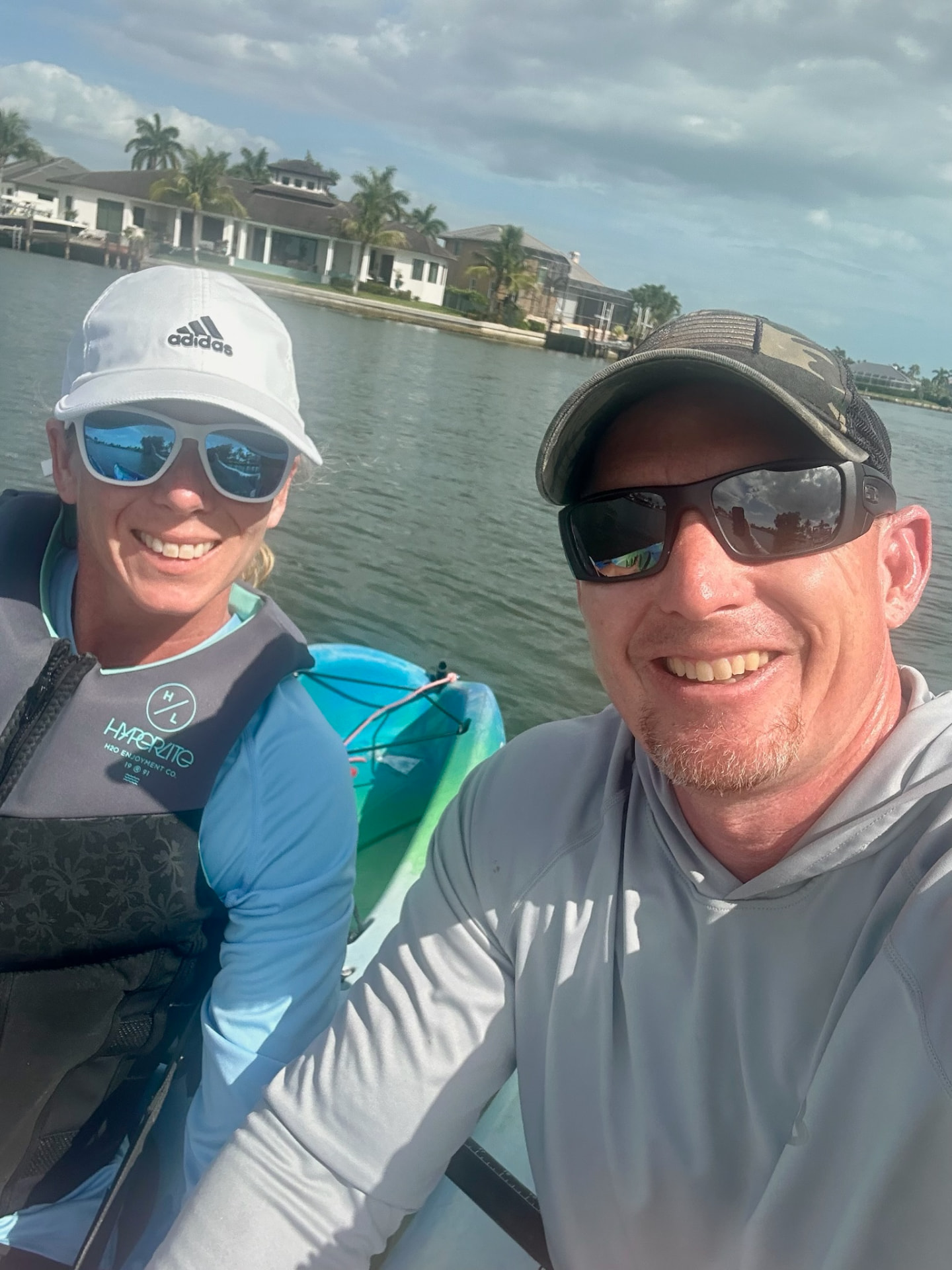 Travis and Jaime wearing life vests while kayaking on Marco Island