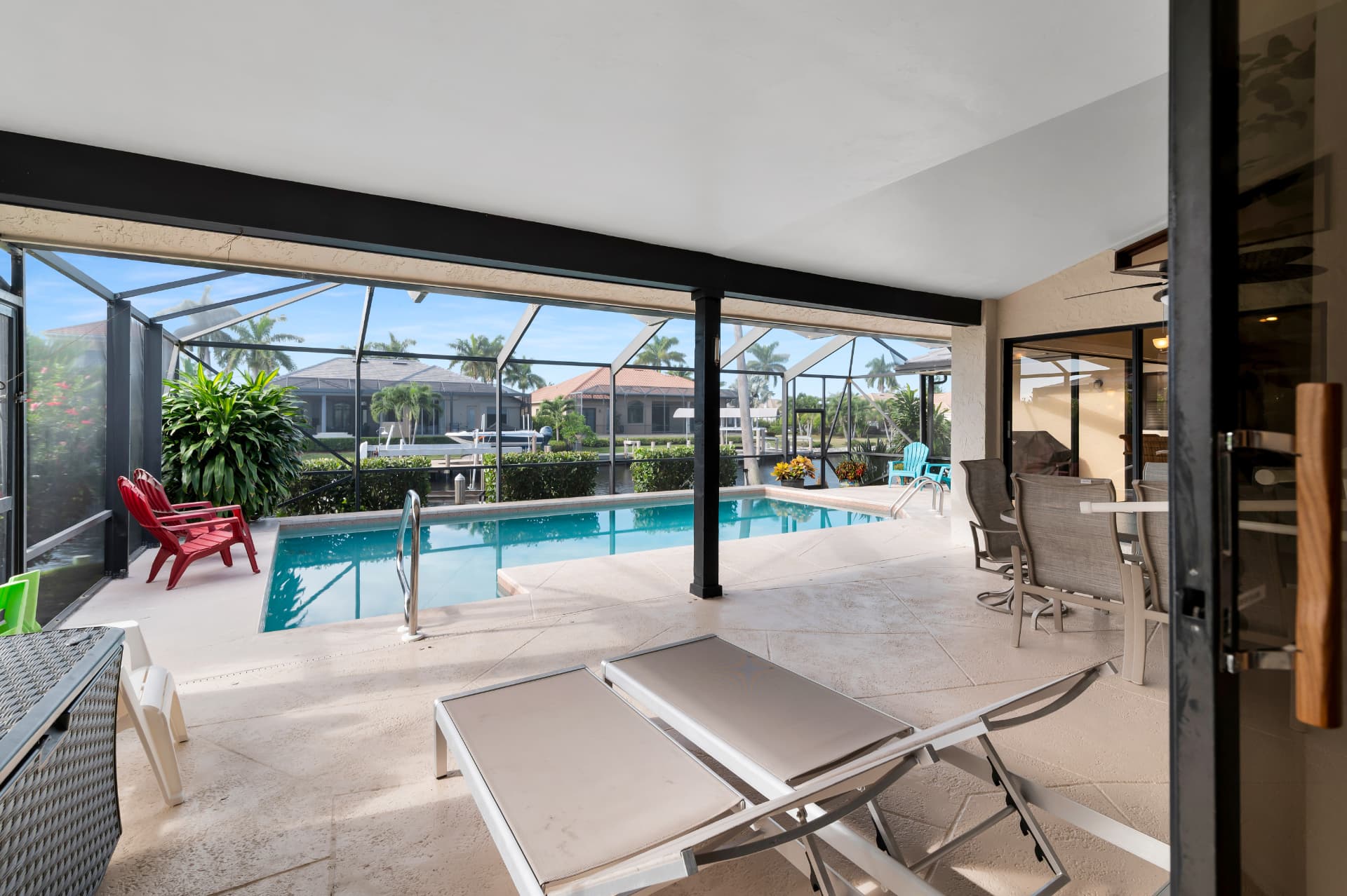 Screened pool patio where dogs can be outside at Pirates Cove Marco Island