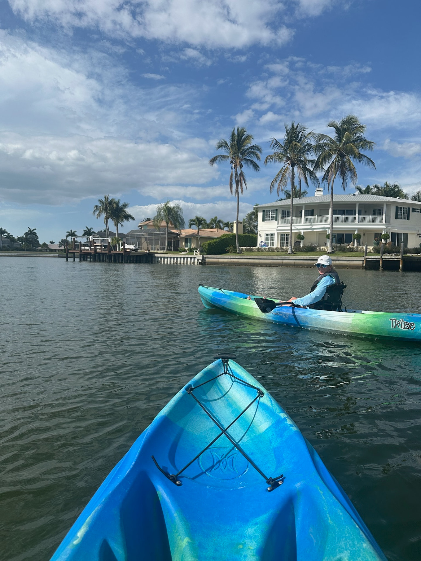 View from a kayak on a palm-lined Marco Island canal