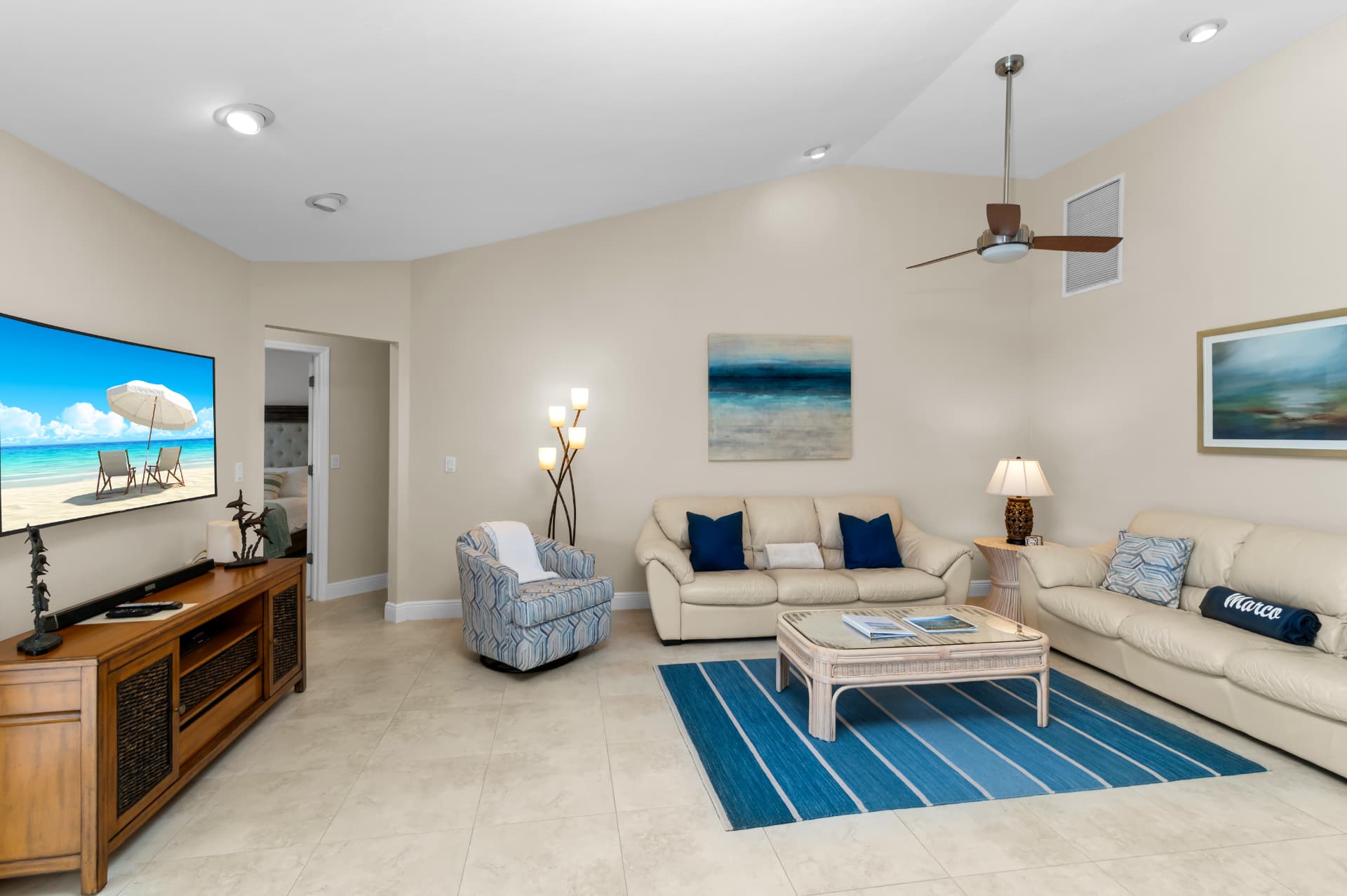 Second living room with sofas and TV at Pirates Cove Marco Island