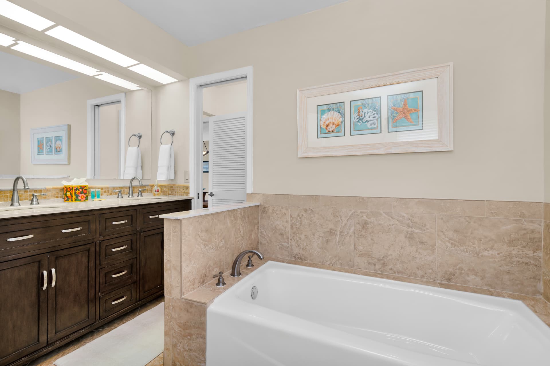 Bathroom with soaking tub at Pirates Cove Marco Island