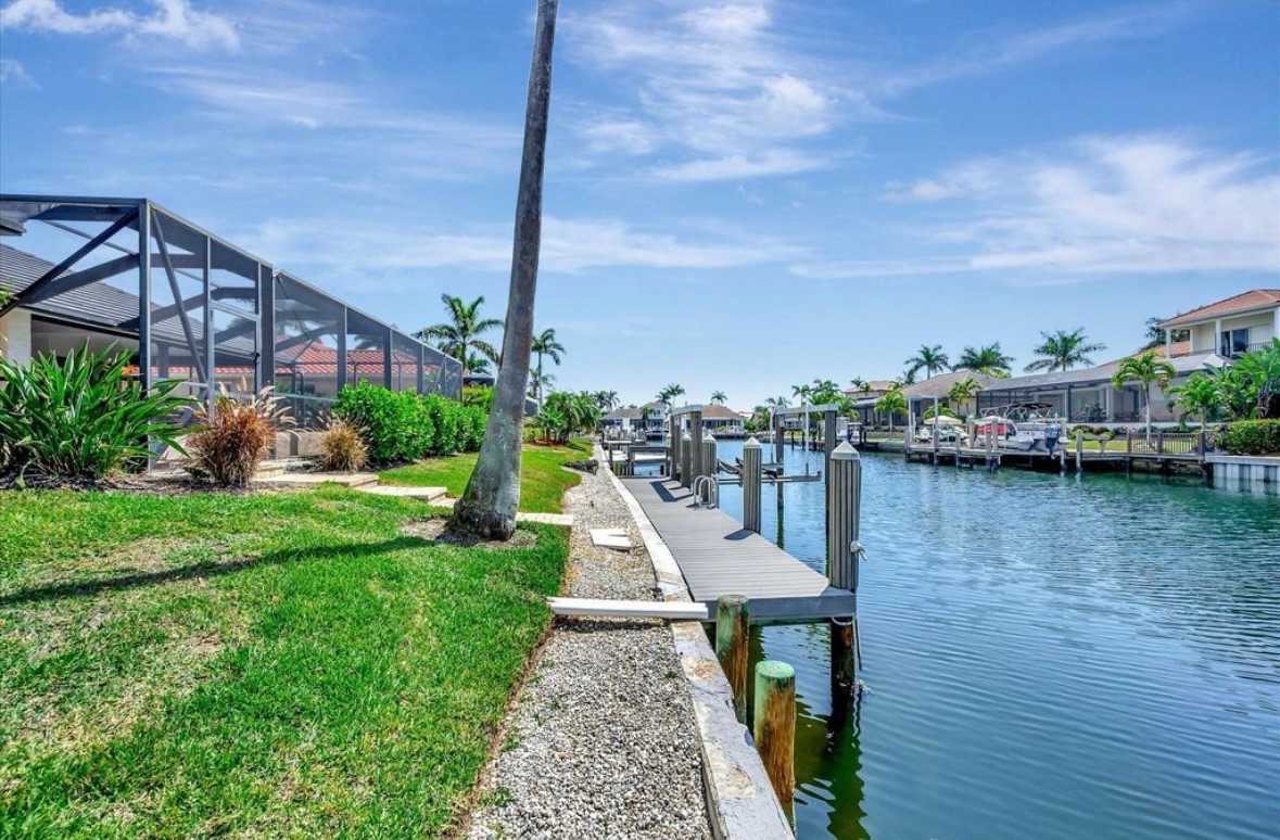Canal and neighboring waterfront homes near Pirates Cove Marco Island