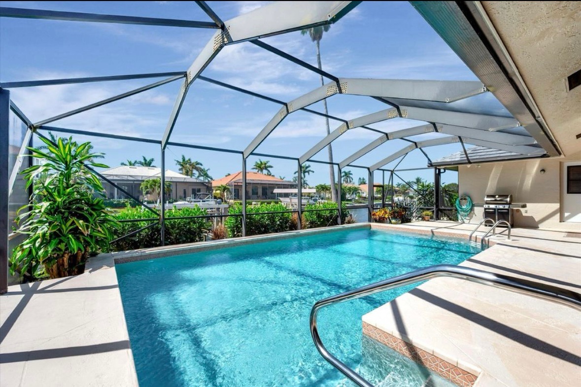 Raised spa beside the heated pool at Pirates Cove Marco Island