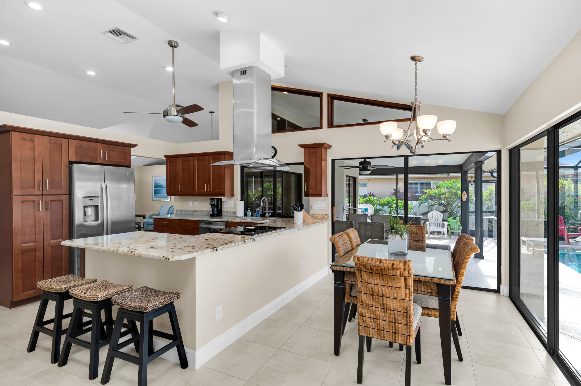Kitchen and dining area with island seating at Pirates Cove Marco Island