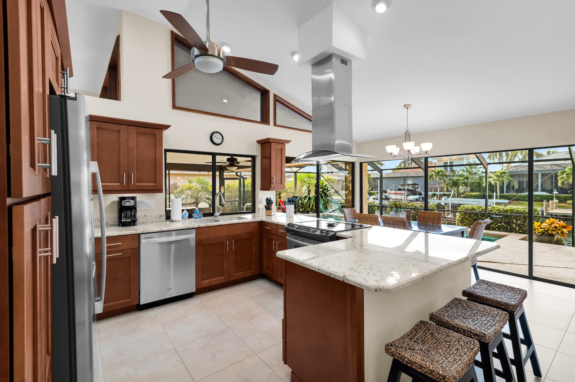 Kitchen with granite island and stainless appliances at Pirates Cove Marco Island